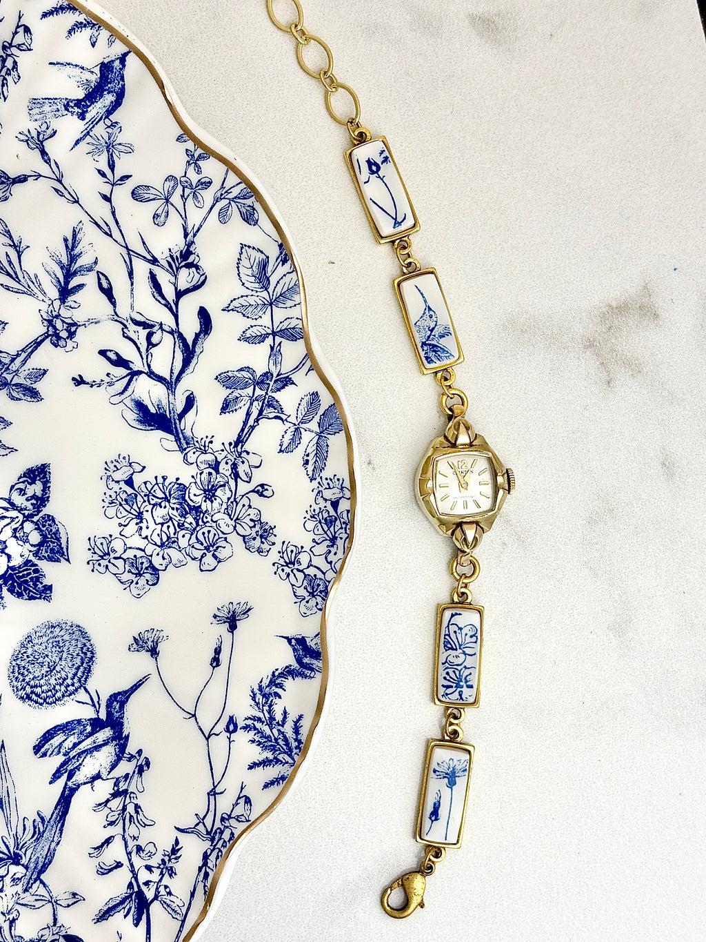 Antique Clinton manual watch with blue hummingbirds