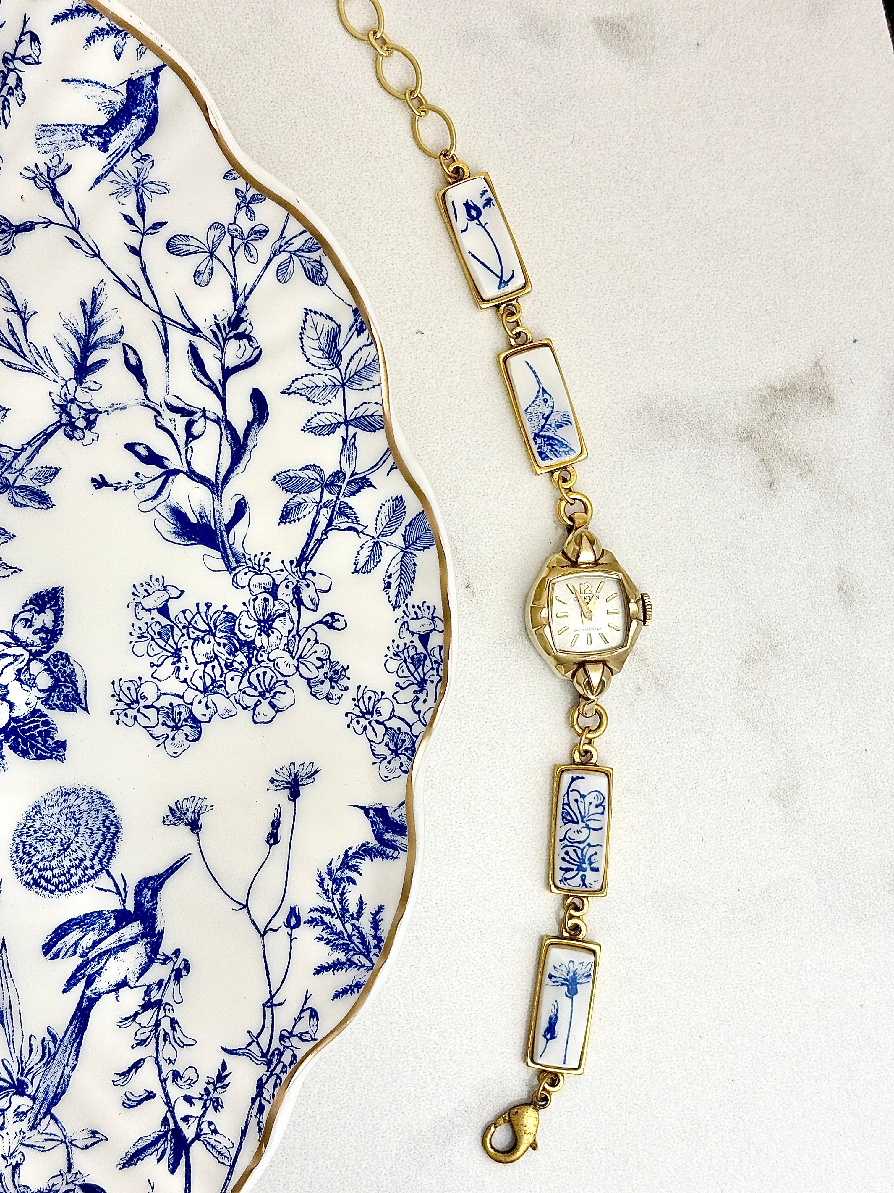 Antique Clinton manual watch with blue hummingbirds