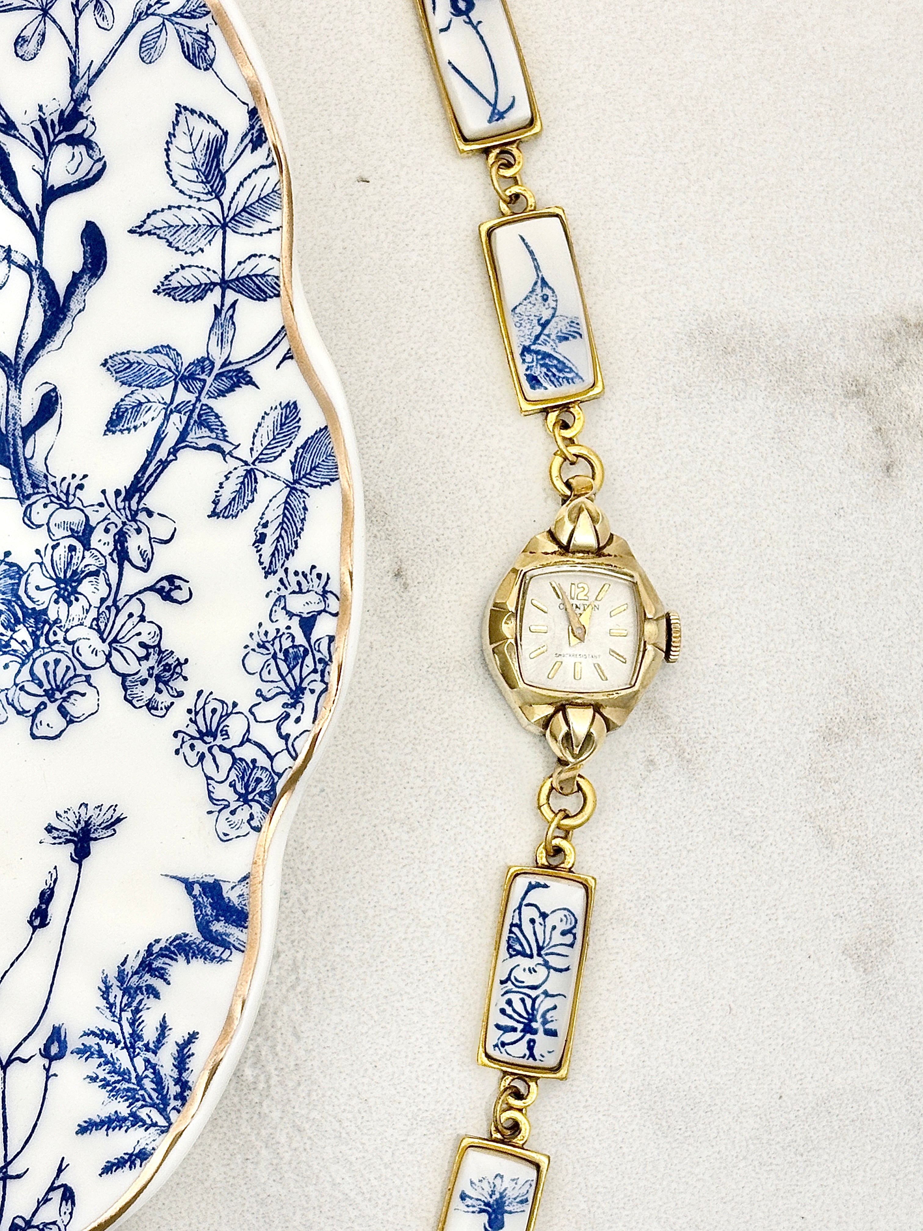 Antique Clinton manual watch with blue hummingbirds