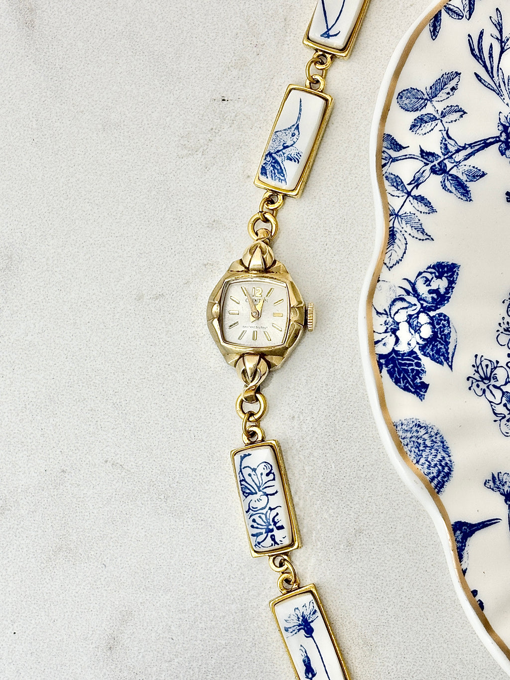 Antique Clinton manual watch with blue hummingbirds