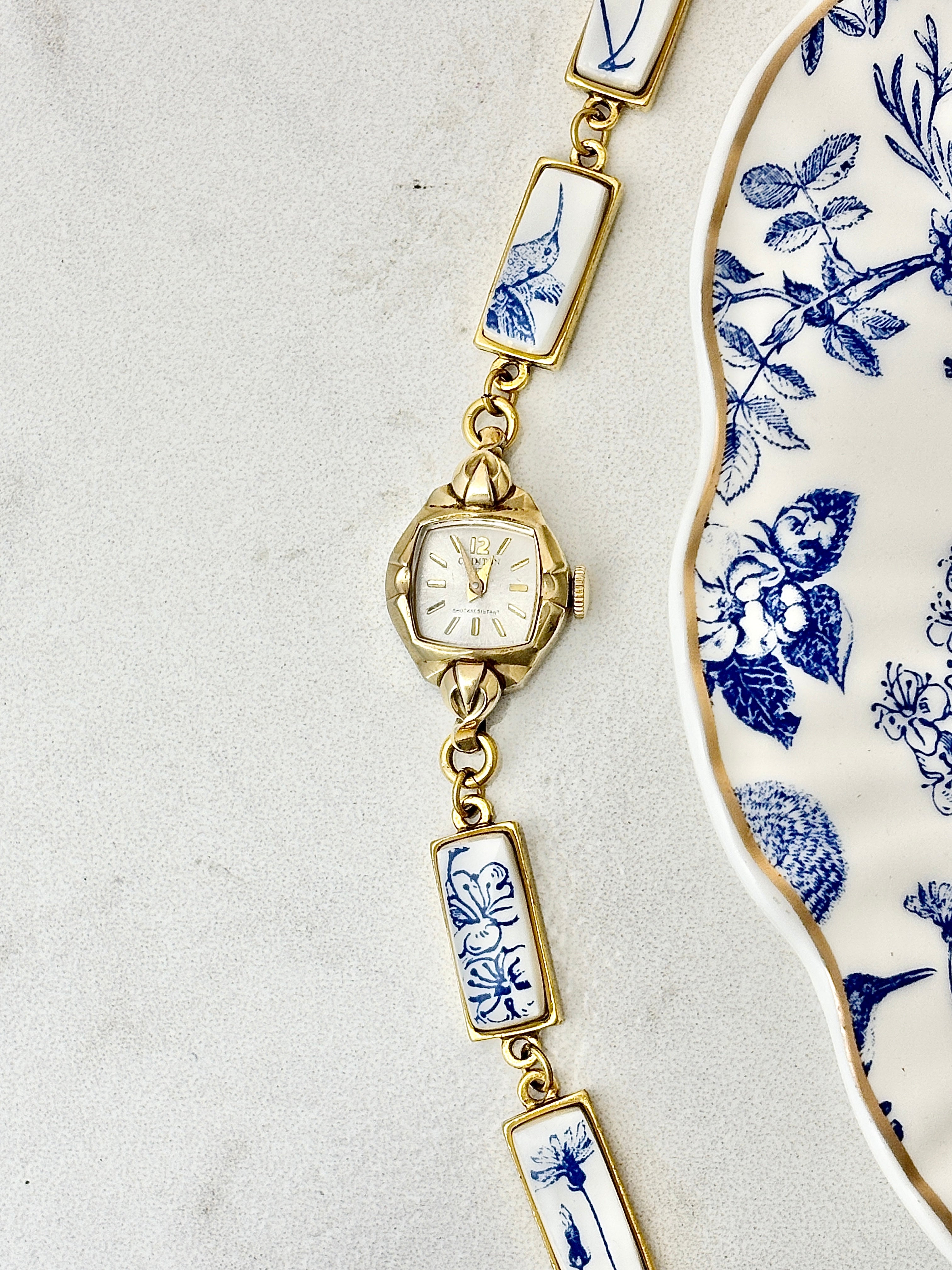 Antique Clinton manual watch with blue hummingbirds