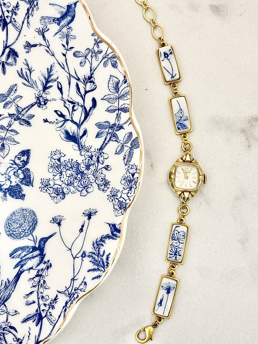 Antique Clinton manual watch with blue hummingbirds